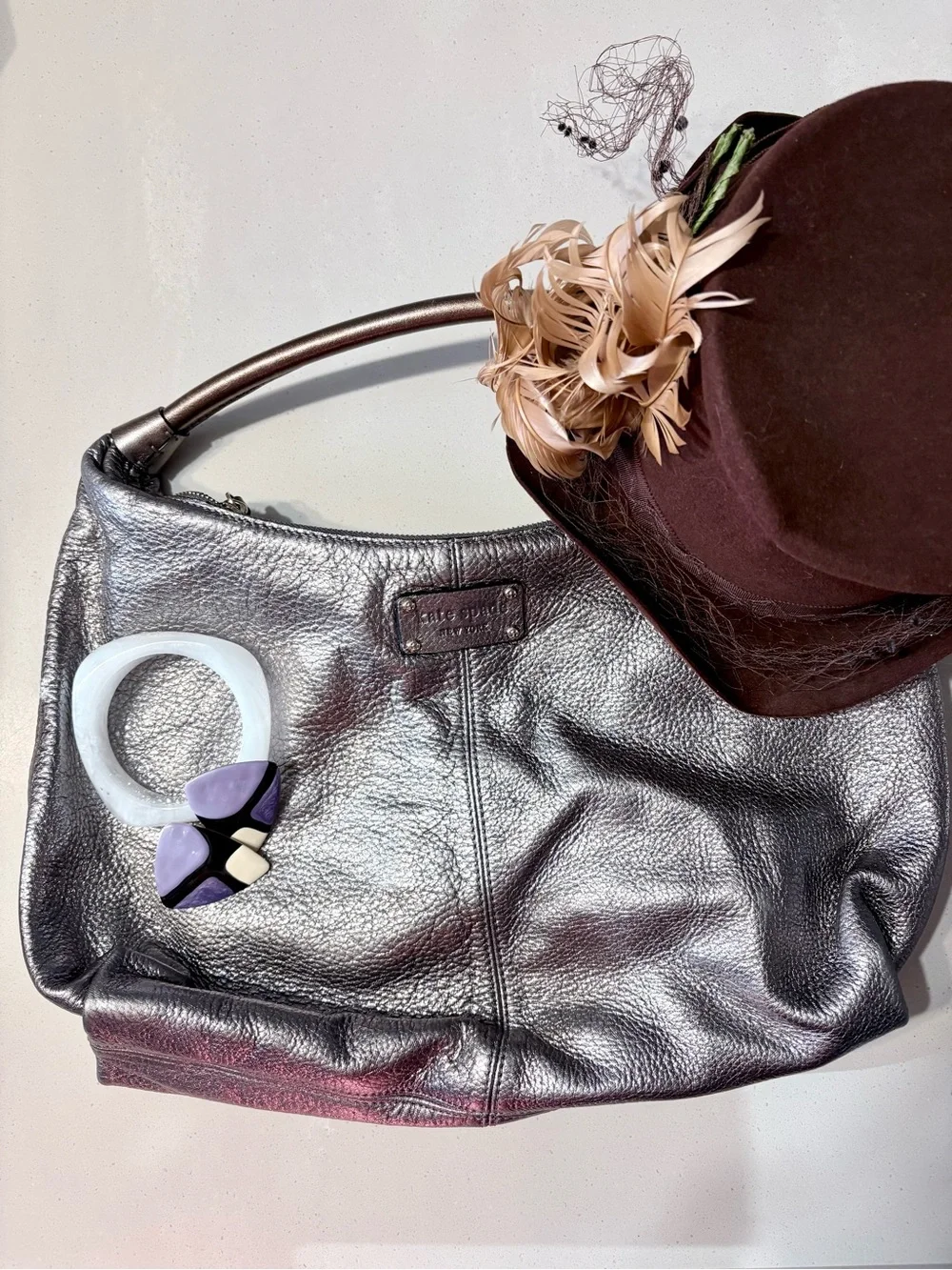 Kate Spade Janaya shiny silver hobo bag